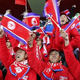 Illustration for article titled North Korean Soccer Fans Are Actually Chinese Volunteers (UPDATE)